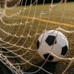 Soccer ball in the gate net, nobody
